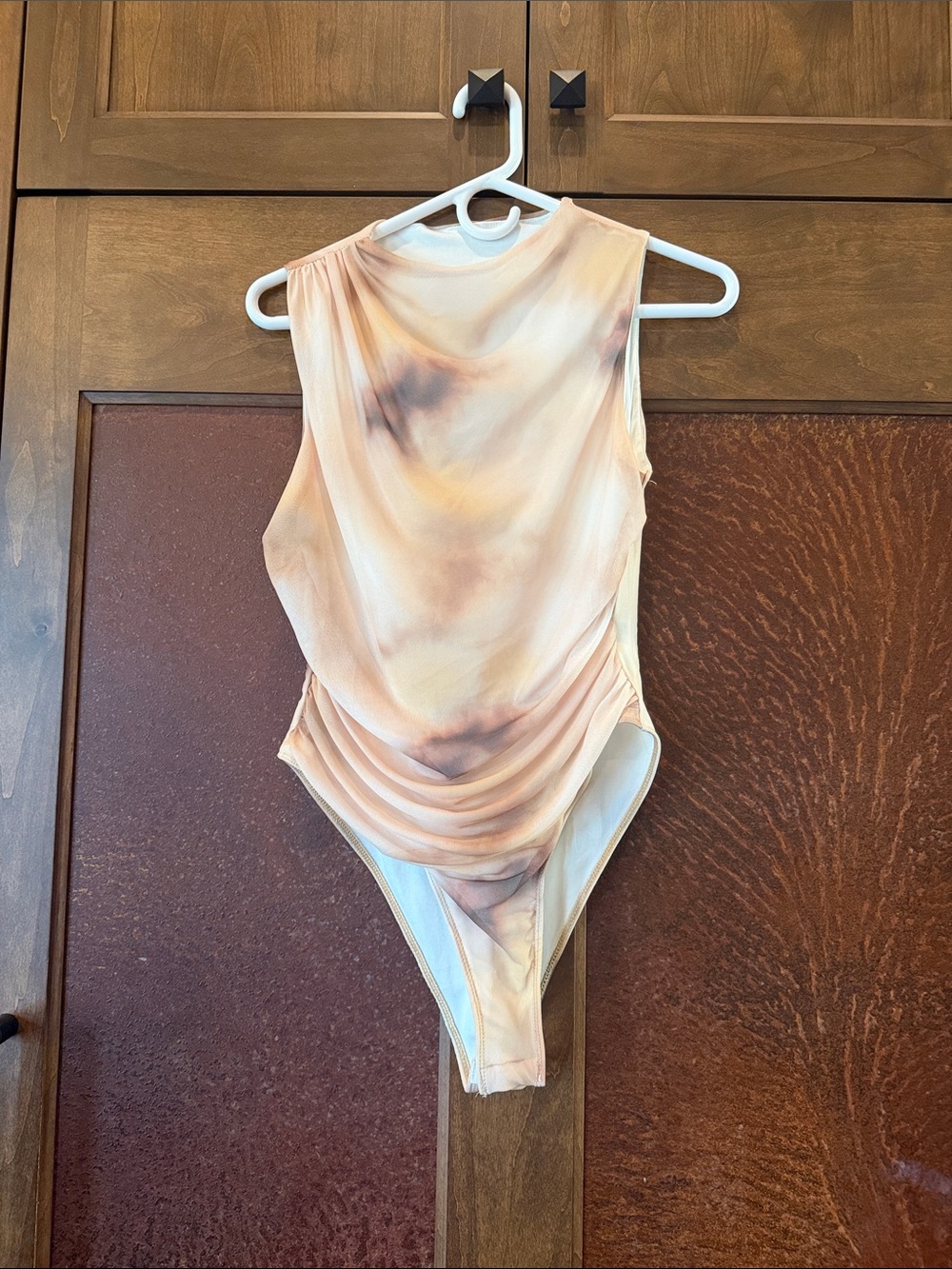 Mesh lined women’s body suit size m